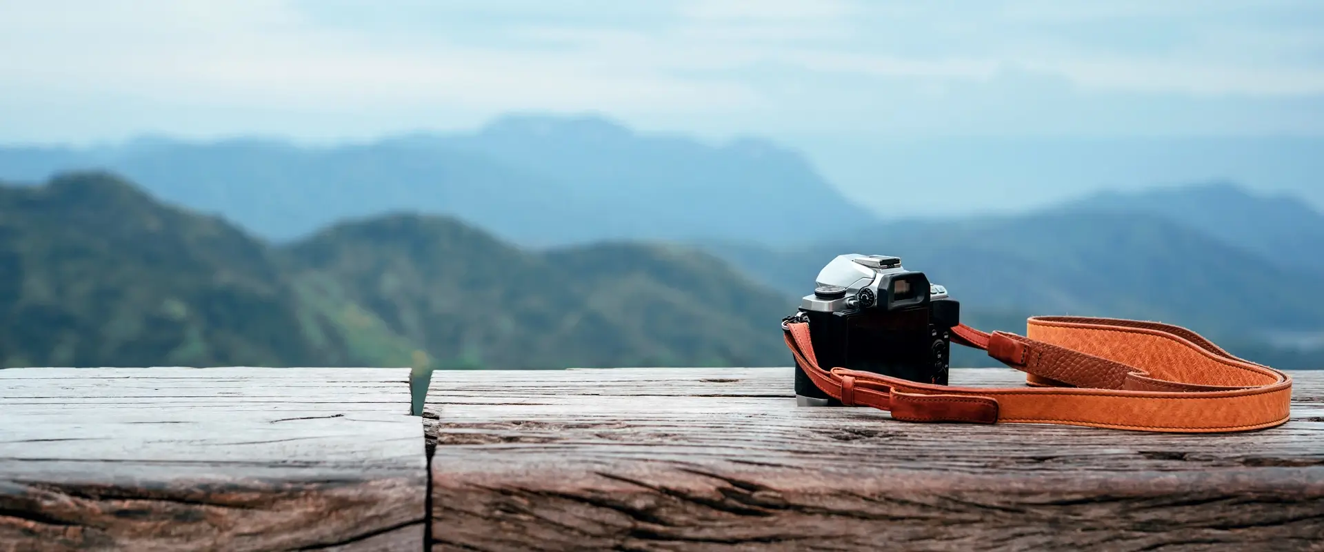 Camera on the background of a mountain landscape