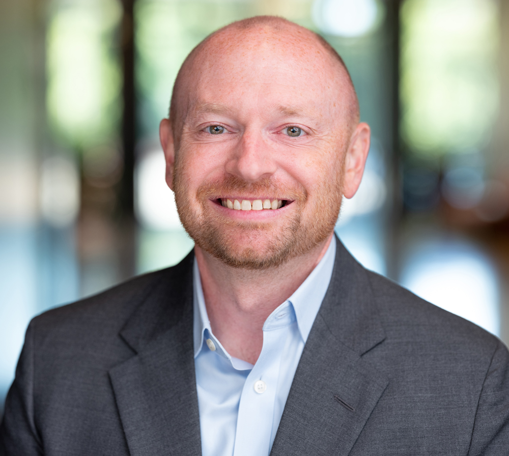 Headshot of Jensen, Managing Director Allen Bond