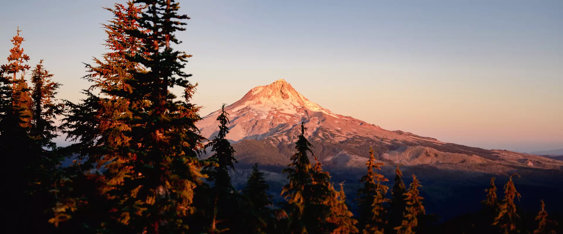 A mountain with a peak covered with snow