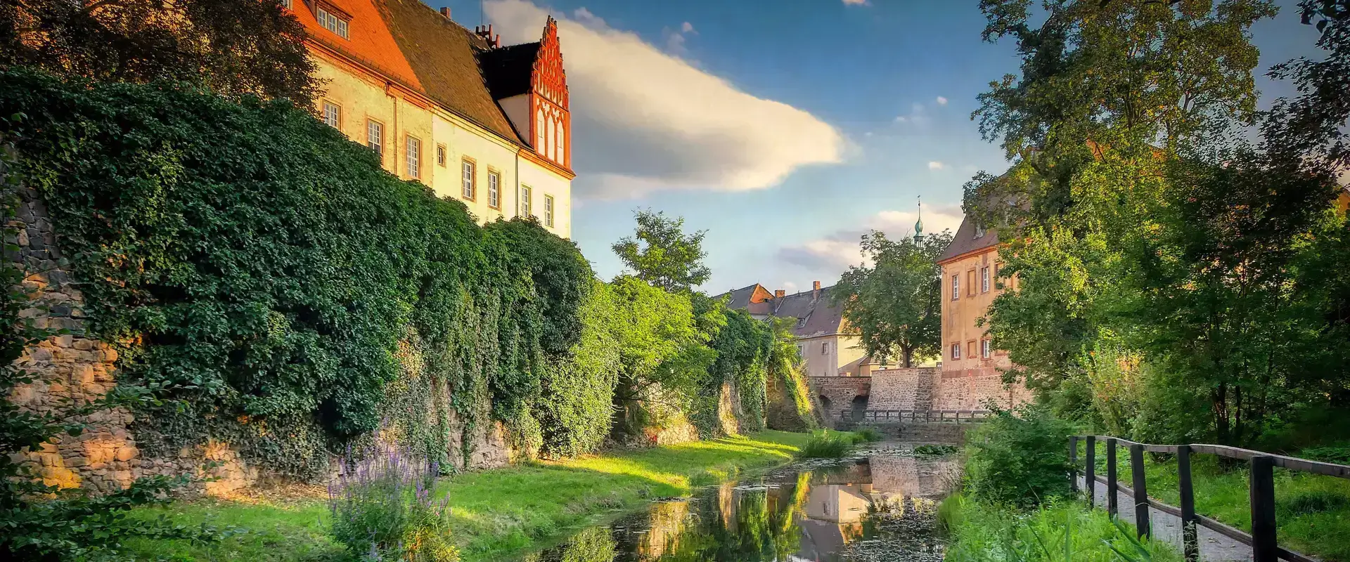 Village, river, and greenery surroundings