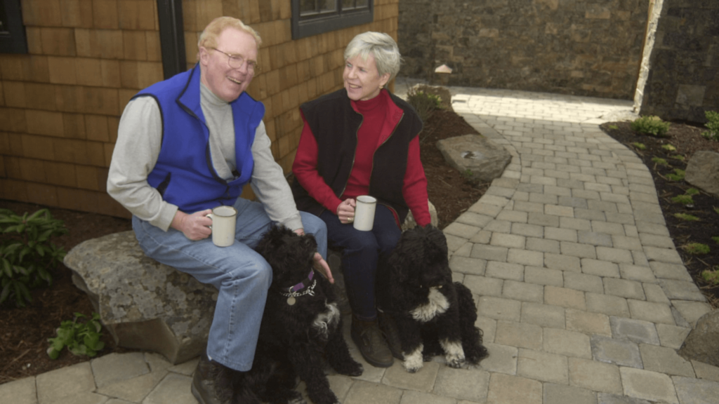 Photo of Founding Director Val Jensen and his wife and dogs.